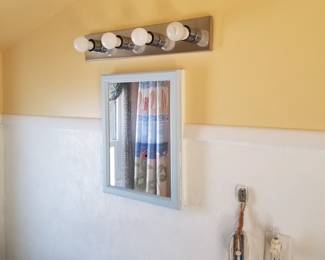 Medicine cabinet; bathroom light