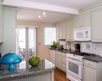 Very pretty celery kitchen with Centra cabinetry