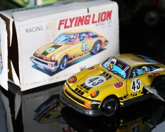 Lot of 7 Vintage Wind-Up Tin Litho Toys in Box - Schylling Graf Zeppelin - Flying Lion Racing Car - Clockwork Motorcycle with Sidecar - Airplanes - Russian Train Station	3 x 10 x 5 in largest box	198032
