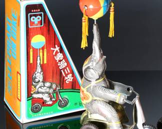 Lot of 3 Vintage Blic Wind-Up Tin Litho Elephant on Bike Toys in Box	6 x 14 x 10 in	198028
