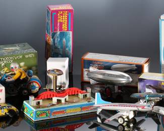 Lot of 7 Vintage Wind-Up Tin Litho Toys in Box - Schylling Graf Zeppelin - Flying Lion Racing Car - Clockwork Motorcycle with Sidecar - Airplanes - Russian Train Station	3 x 10 x 5 in largest box	198032
