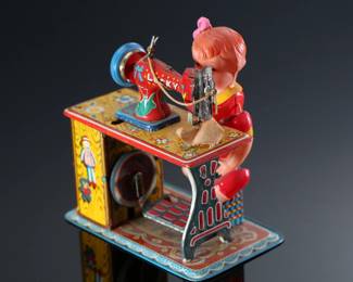 Vintage Japanese Tin & Celluloid Windup Lucky Baby Sewing Machine Toy	5.5x4.75x3.25in	196107

