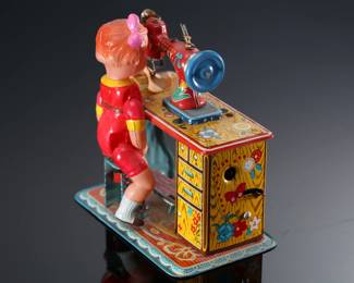 Vintage Japanese Tin & Celluloid Windup Lucky Baby Sewing Machine Toy	5.5x4.75x3.25in	196107
