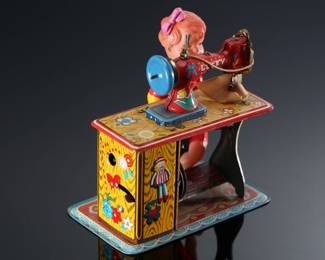 Vintage Japanese Tin & Celluloid Windup Lucky Baby Sewing Machine Toy	5.5x4.75x3.25in	196107
