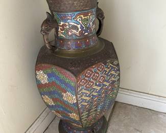 Rad brass and enamel vase.