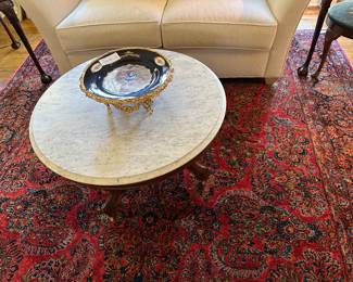 marble top coffee table, with Serve’s plate