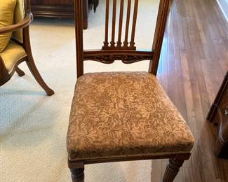 Antique oak American chair with front casters