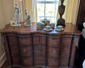Modern chest with drawers, carved base