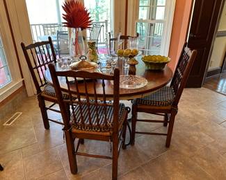 Wrought iron table base with oak top and oak chairs with rush seats