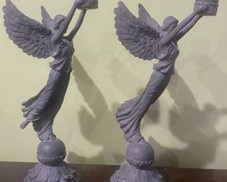 Lovely candle stick holders I have a vintage look and graceful appearance. 16” tall. A valued item on Internet sales. $100 for the pair firm. 