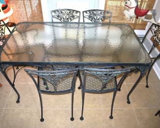 Woodard wrought iron tempered glass dining table,nice one.Clean. 