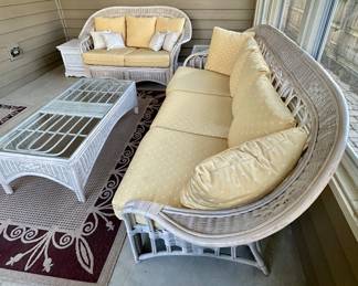 Sunroom Suite includes: 3 Cushion Wicker Sofa, 2 Cushion Wicker Loveseat, Glass and Wicker Coffee Table and Glass and Wicker Side Table.