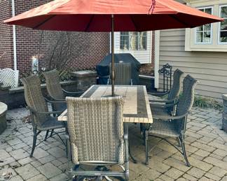Patio Dining Set:  Stone and Slate 84" L x 44" W x 30" H Dining Table.  Treasure Garden Umbrella and Stand. 6 Frontage Outdoor Dining Chairs (2 Carlisle Woven Swivel Rockers + 4 Carlisle Woven Dining Chairs). Current Retail is $1699.00 a Pair