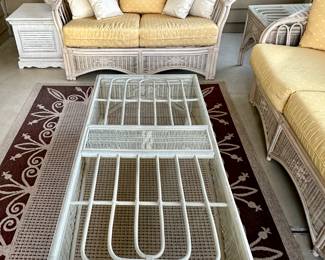 Sunroom Suite includes: 3 Cushion Wicker Sofa, 2 Cushion Wicker Loveseat, Glass and Wicker Coffee Table and Glass and Wicker Side Table.