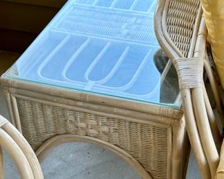 Sunroom Suite includes: 3 Cushion Wicker Sofa, 2 Cushion Wicker Loveseat, Glass and Wicker Coffee Table and Glass and Wicker Side Table.