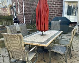 Patio Dining Set:  Stone and Slate 84" L x 44" W x 30" H Dining Table.  Treasure Garden Umbrella and Stand. 6 Frontage Outdoor Dining Chairs (2 Carlisle Woven Swivel Rockers + 4 Carlisle Woven Dining Chairs). Current Retail is $1699.00 a Pair