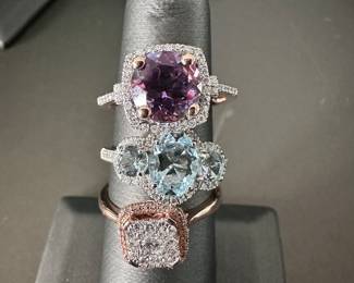 Beautiful 14k gold rings from top to bottom: rose gold amethyst and diamond ring with cushion halo, aquamarine 3-stone diamond halo ring, rose gold cushion shaped diamond ring.
