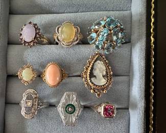 Incredible selection of vintage gold jewelry. Top row: 14k Lavendar Jadeite and Diamond , Opal and Diamond in Sterling, 10k Blue topaz pyramid ring. Middle row: 14k opal and diamond, 18k Angel Skin coral ring, 14k Carved Shell Cameo. Bottom row: 14k Art Deco Diamond , 14k Camphor Glass with green agate and diamond, 14k pink tourmaline filigree ring. Wear them all! One for each finger!