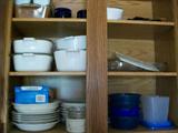 Cabinet filled with Corning Ware and Tupperware