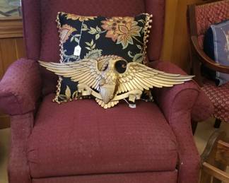 Small recliner and vintage metal eagle.