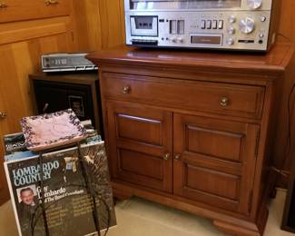 Swell cherry music cabinet, McDonald AM/FM receiver with cassette and 8 trac, and cool album/ ash tray stand.
