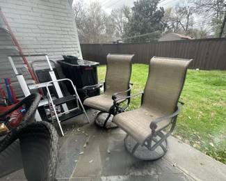 Pair of Emerald outdoor swivel lounge chairs