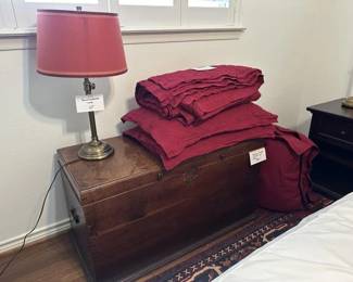 Antique English oak storage chest, Pottery Barn Queen Size Red Linen Set with Quilted Spread, 2 King Pillows and 2 Euro Pillows