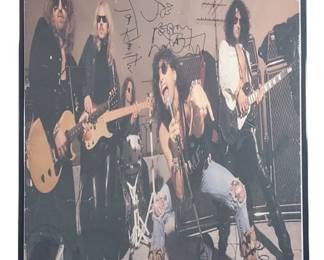 Aerosmith Band Signed Poster with Dunlop Picks