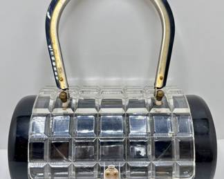 Vintage Lucite & Bakelite Capsule Shaped Bag With Metal Hardware
Lot #: 25