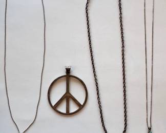 Sterling Silver Peace Sign Pendant & 3 Sterling Necklaces: Miniature Cutlery, Charms & 2 Sided Cross
Lot #: 44