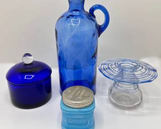 Blue Glassware: Antique Bottle, Covered Jar, Cold Cream Jar With Lid & Wire Wrapped Candle Holder
Lot #: 134