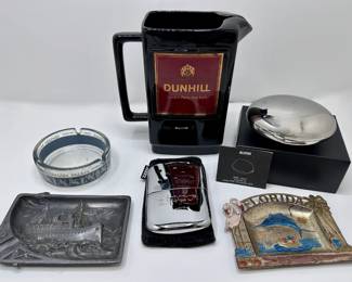 Vintage Dunhill Pitcher, New Alessi Cigarette Set, New Zippo Chrome Hand Warmer, Pewter Ashtray & More
Lot #: 176