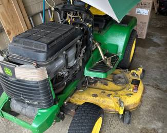 #73	John Deere GS345 Riding Mower, missing top, seat cracked but runs great w/umbrella	 $1,200.00 
