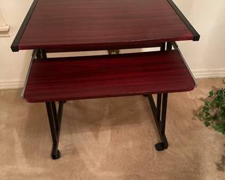 #8  (View 2) Laminate-Aluminum Base Rolling Desk with pull-out keyboard  24.5Wx19-24Dx28T  $30.00 