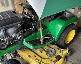 #73	John Deere GS345 Riding Mower, missing top, seat cracked but runs great w/umbrella	 $1,200.00 
