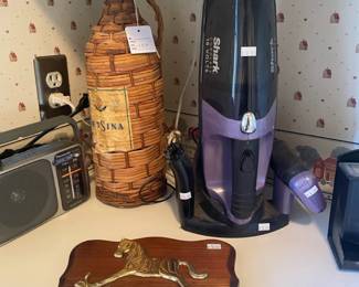 Shark cordless 18 volts hand vacuum, Wood and brass horse key holder, vintage wicker Retsina bottle