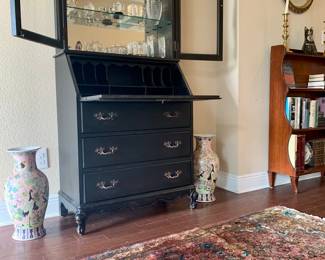 Secretary cabinet with mirror back glass shelf hutch top. 