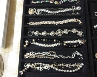 Lots of sterling bracelets.