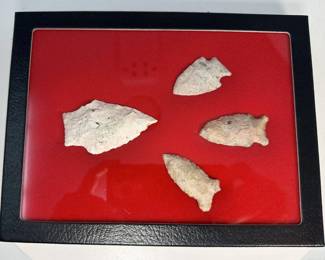 Framed Arrowheads on Red Background