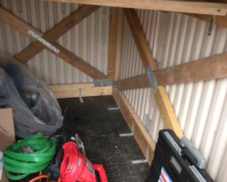 this shed has been reinforced with 2 by 4's and is attached to 4 by 4's. Will easily fit on trailer without being taken apart. Was moved into this location in one piece and can be taken out the same way.
