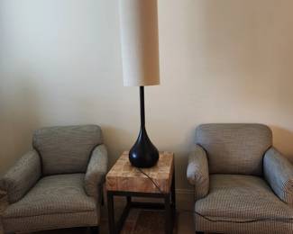 Giant lamps and pair of black and white houndstooth chairs