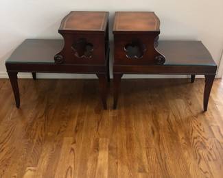 Side view of vintage leather top step end tables.