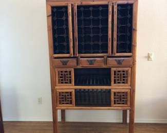 Chinese Kitchen, Pantry, Wine Cabinet. Top Doors open to display wine rack. Three drawers in the middle and two bottom shelves with sliding panel doors.