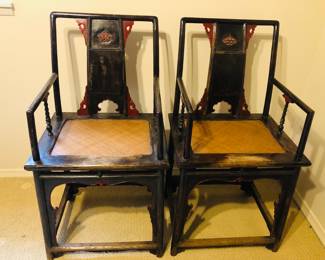 Antique pair of Official-Hat Armchairs with black and red lacquer finish made in elm from Shanxi Province, Circa 17th - 18th Century. Chairs are approximately 40.5in tall and seat height is approx 22in from the floor.
