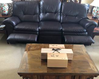 Showing Leather Lazboy sofa with reclining end seats.