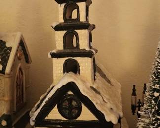 Lighted Christmas Church Covered with Snow 