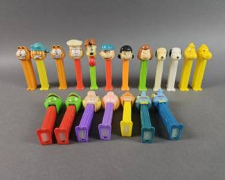Lot 256 | Garfield, Peanuts, and The Muppets Pez Dispensers