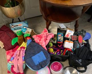 Assorted dog sweaters, vests, grooming combs and brushes, thunder shirt(new) 
Bowls, professional blow dryer etc $2 on up 