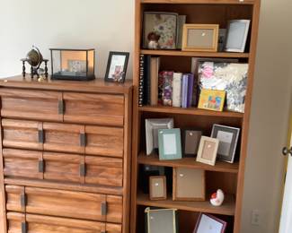 Chest of drawers, bookcase, picture frames