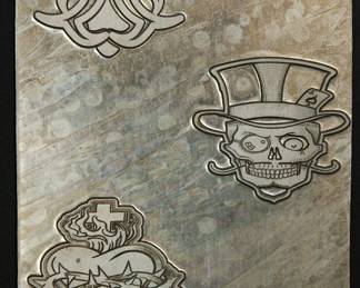 Detail of metal plates used as models when The Alley made statuary products for many major rocks groups, including AC/DC, The Ramones, The Rolling Stones, Pantera, Garbage, and Dead Kennedys